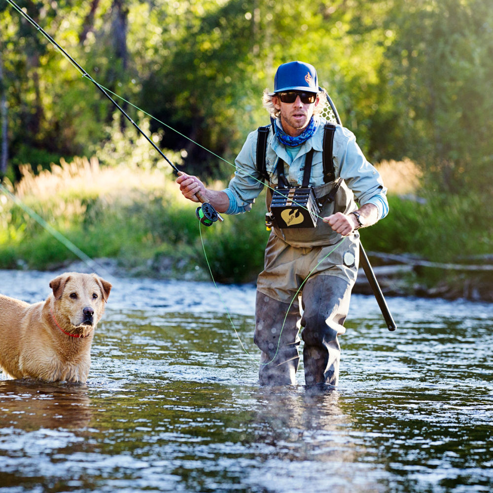 Angler and his dog, fishing