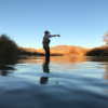 Female angler casting on the water. Sun Valley Idaho Fly Fishing. | Silver Creek Outfitters