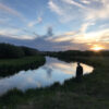 Fly fishing Sun Valley | Silver Creek Outfitters | Angler standing on the edge of the water at sunset