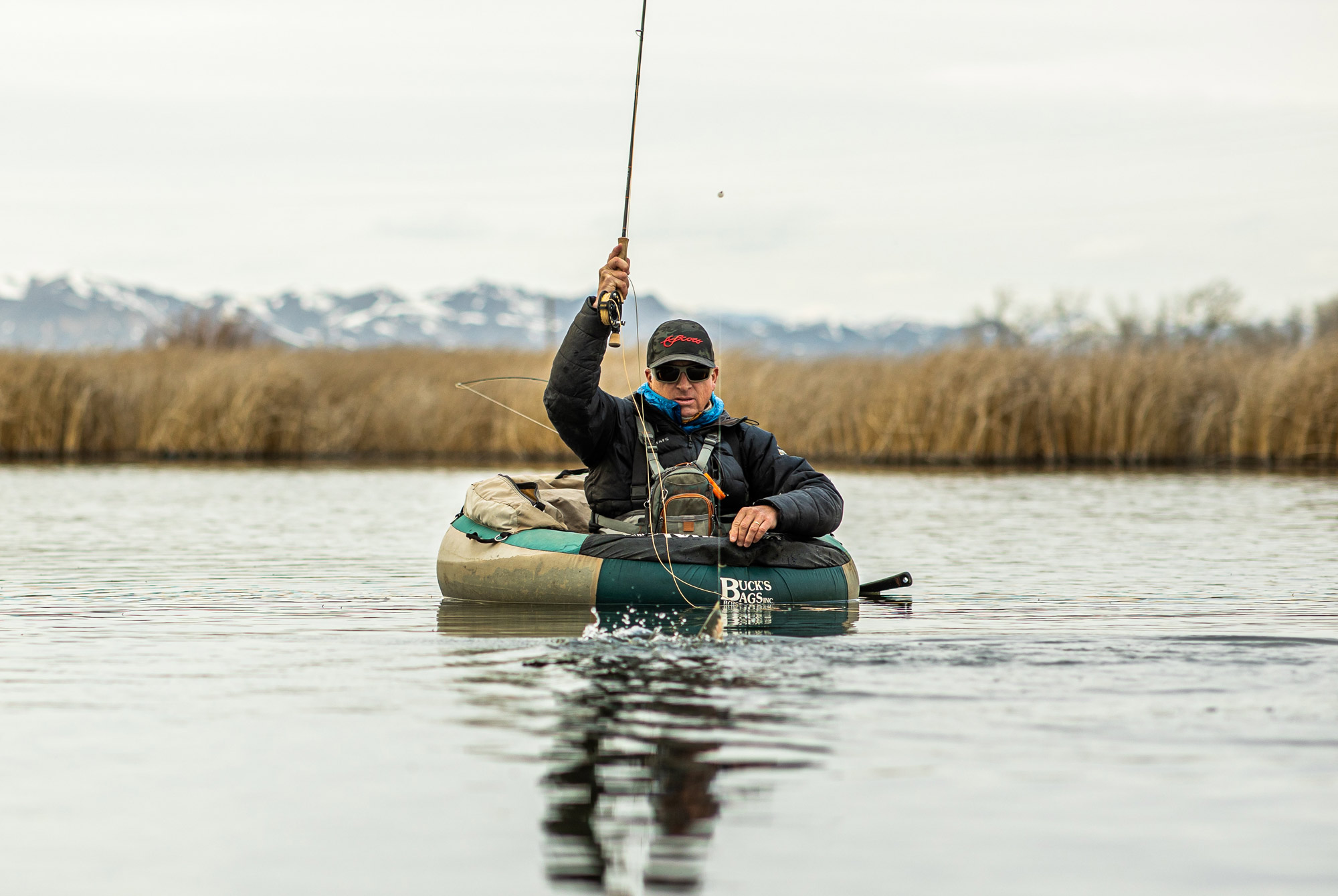 Man fly fishing in the spring at Silver Creek Preserve